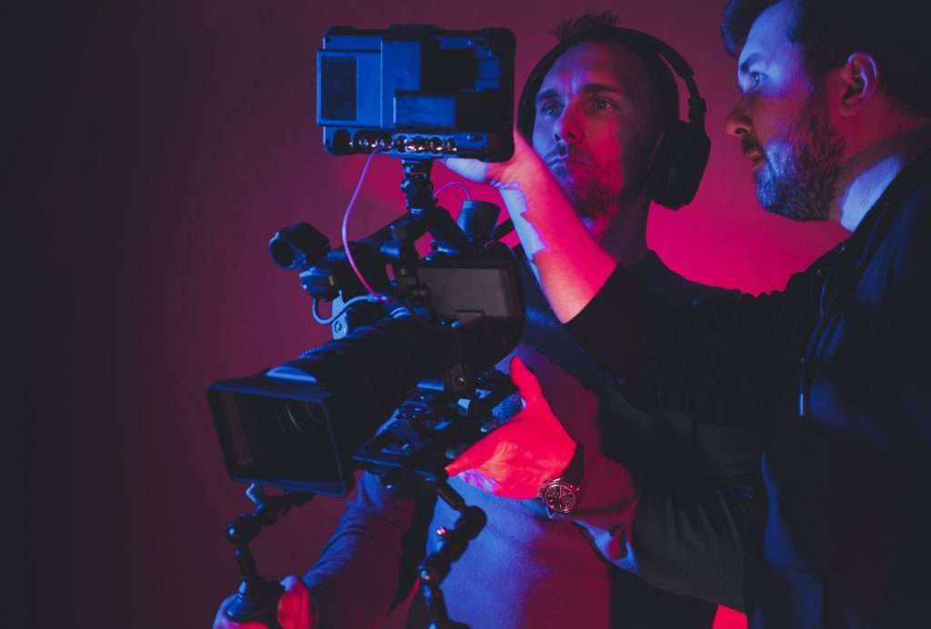 film camera crew consulting newly taken footage 2022 12 16 11 42 27 utc