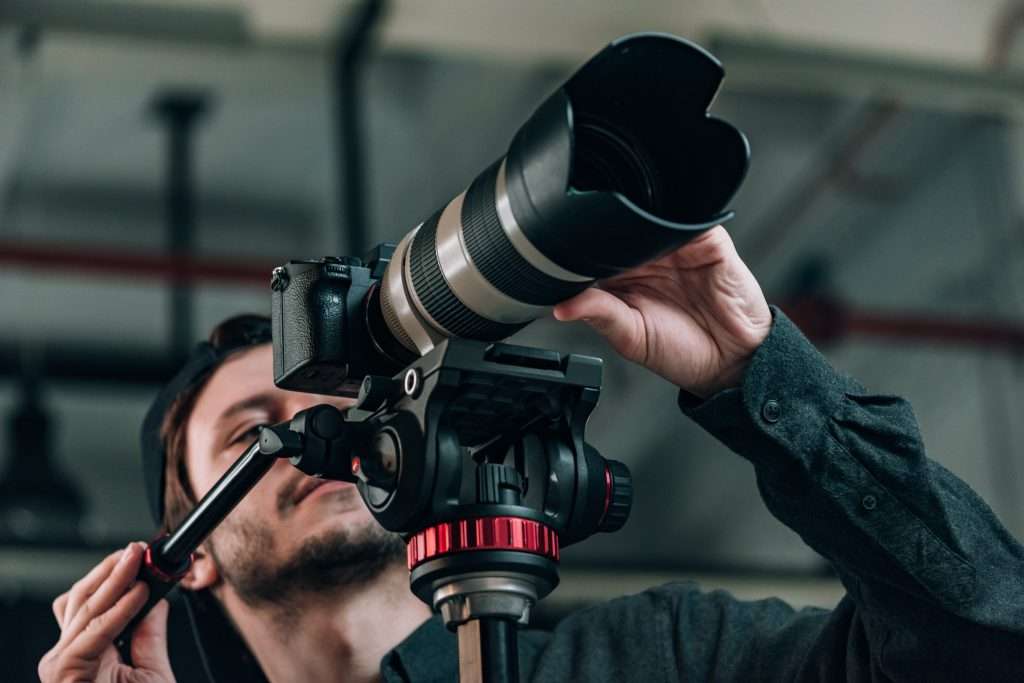 low angle view of cameraman looking at camera disp 2022 12 16 18 37 41 utc 1