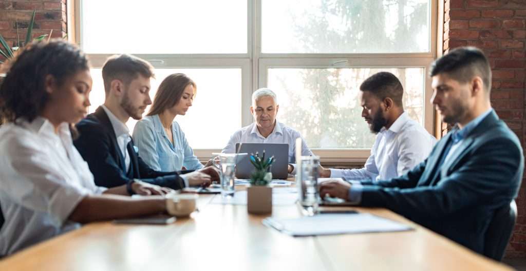 colleagues working during corporate meeting sittin 2022 12 16 08 42 46 utc